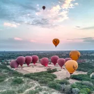 Hot-air balloons taking off in the morning light over Bagan