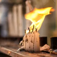 Burning candles with dripping wax