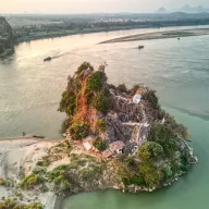Rocky island with a pagoda in the river near Hpa-An, from above