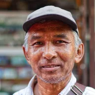 Portrait of an elderly man with a grey cap