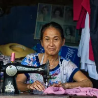 Woman at an old sewing machine